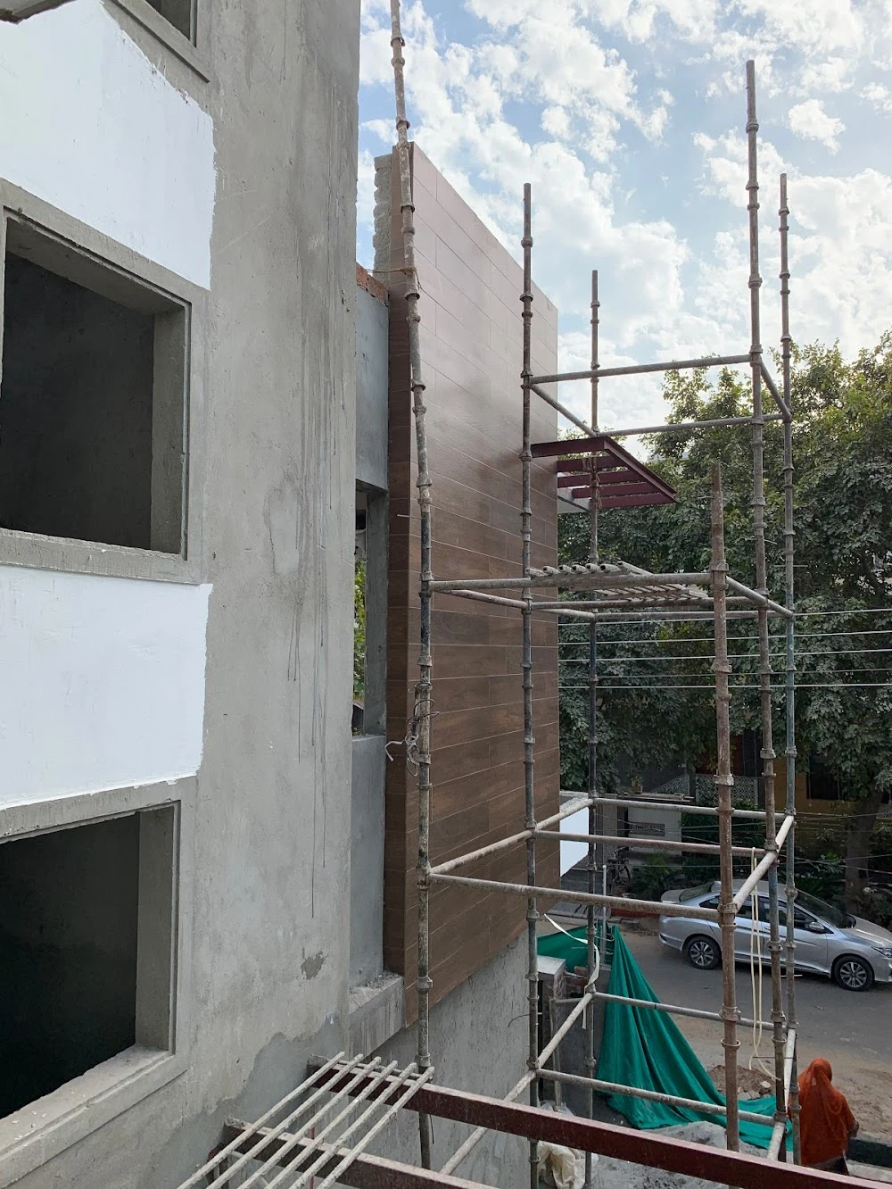 Facade tile cladding quality check during construction — site supervision Gurugram