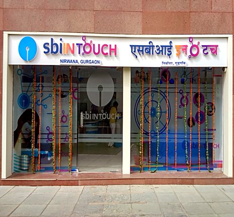 SBI INTOUCH digital bank branch storefront, Nirvana Country Gurugram — banking interior design by Rajiv Marwah & Associates